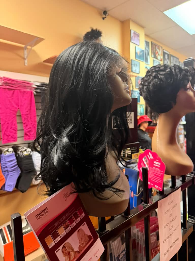 Side view of the Outre Melted Hairline Rosalia long black wavy lace front wig at Beyond Image Suites and Supplies