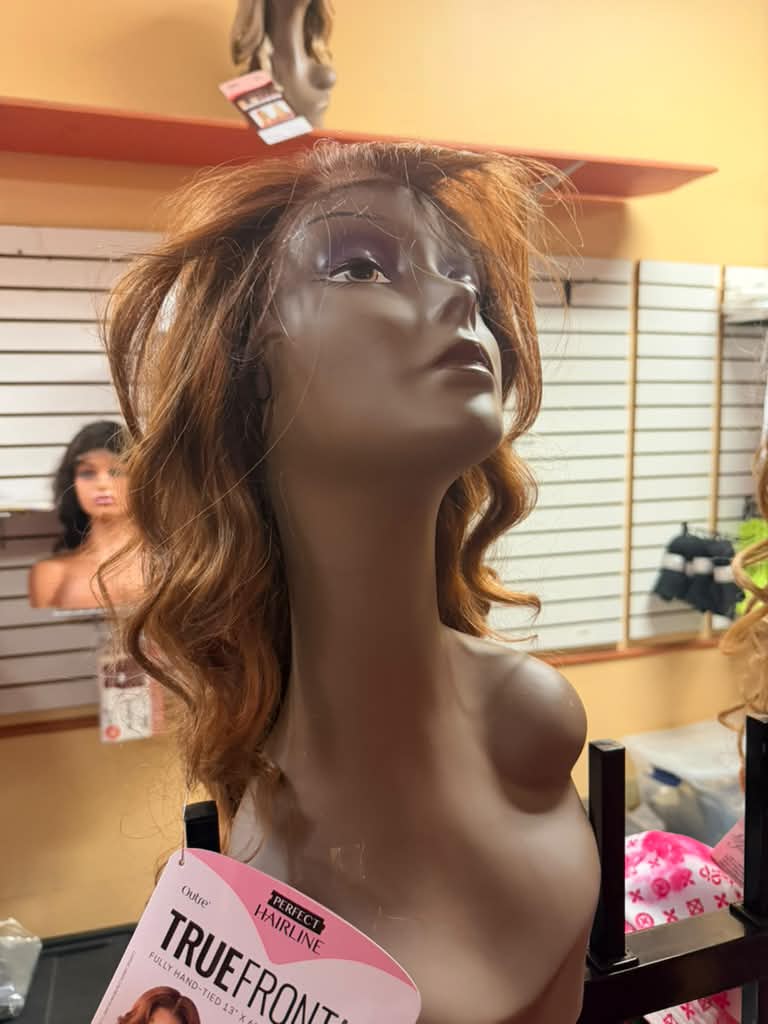 Outre Perfect Hairline True Frontal 13x6 hand-tied lace frontal wig in auburn copper waves on a mannequin