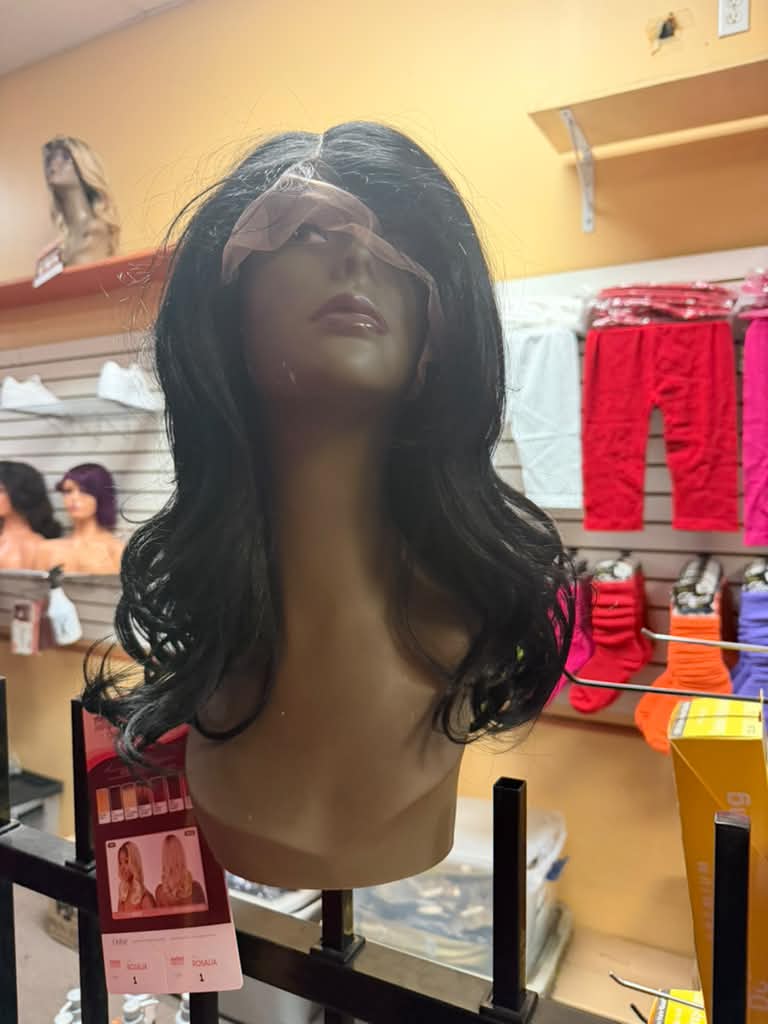 Outre Rosalia long layered black lace front wig with loose waves on a mannequin at Beyond Image Suites and Supplies