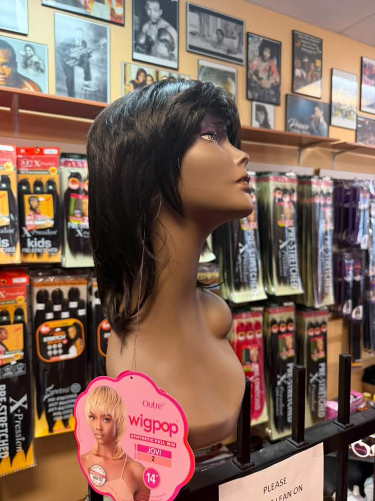 Outre Wigpop Jovi 14-inch synthetic full wig in color 2 with layered shag cut and bangs at Beyond Image Suites and Supplies