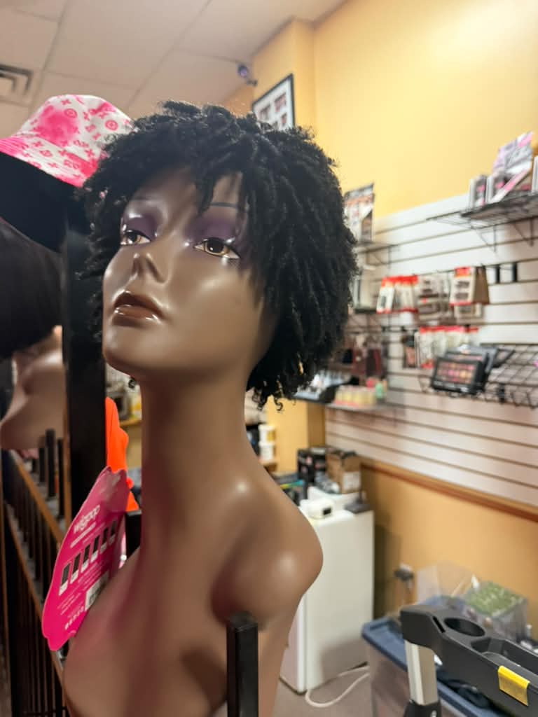 Outre Wigpop short coily black textured wig on a mannequin at Beyond Image Suites and Supplies
