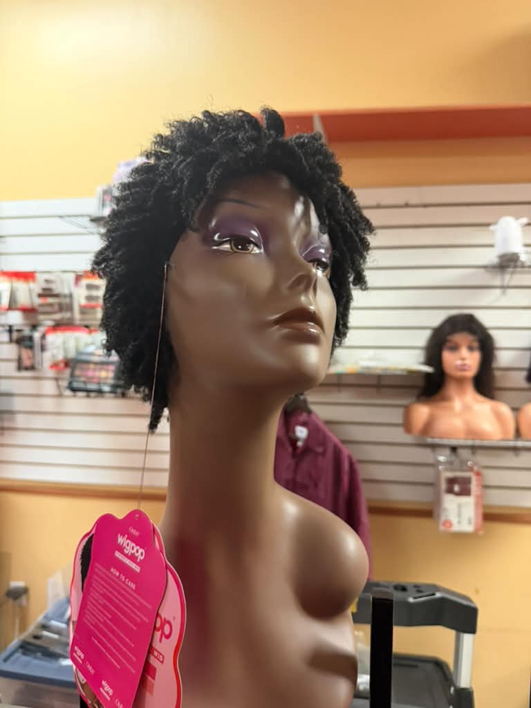 Front angle of an Outre Wigpop short coily black wig with tags at Beyond Image Suites and Supplies